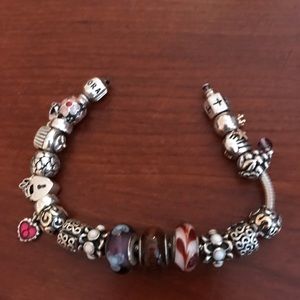 Pandora bracelet with 19 charms.
